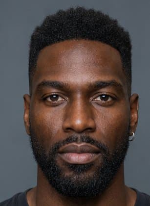 Marcus, from Fun Guy's cast: a man with a short fade, a full beard and a small silver hoop