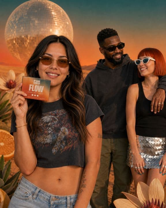 Surreal direction: the cast under a giant disco-ball moon in a sunset-gradient sky