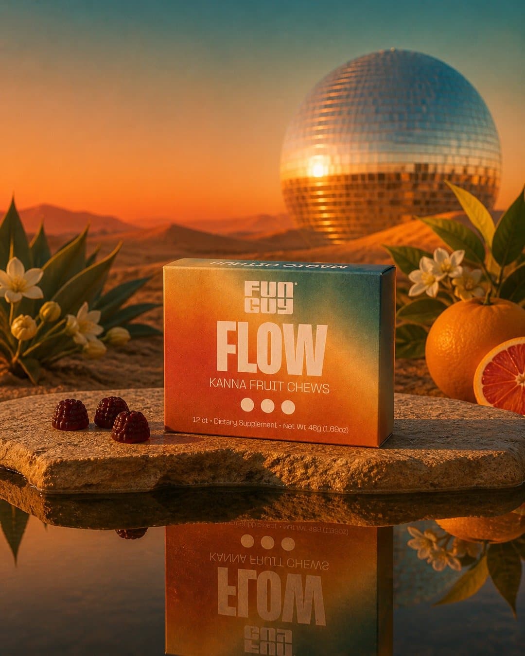 Closed Flow box on a stone ledge over a mirror pool at sunset